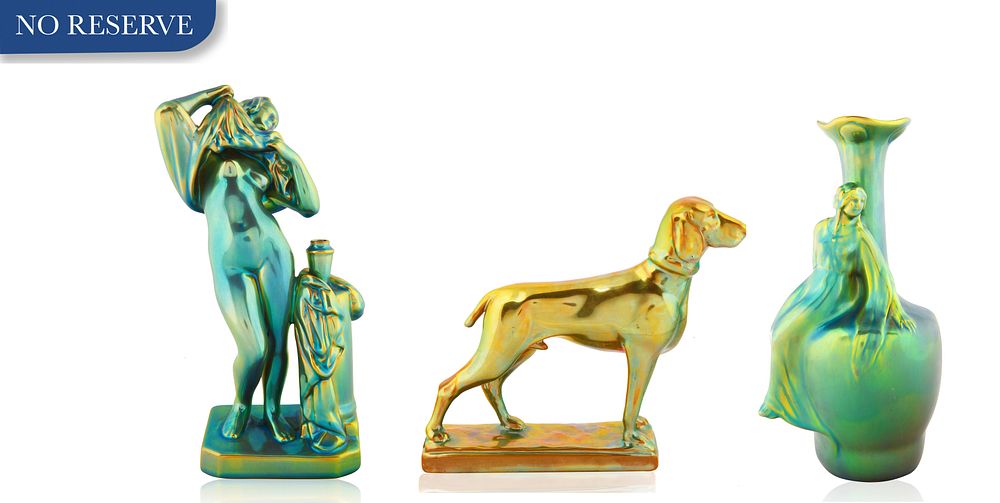 Appraisal: THREE ZSOLNAY EOSIN-GLAZED FIGURINES THREE ZSOLNAY EOSIN-GLAZED FIGURINES comprising a