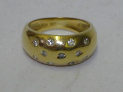 Appraisal: A DIAMOND RING the ct gold cushion band inset with