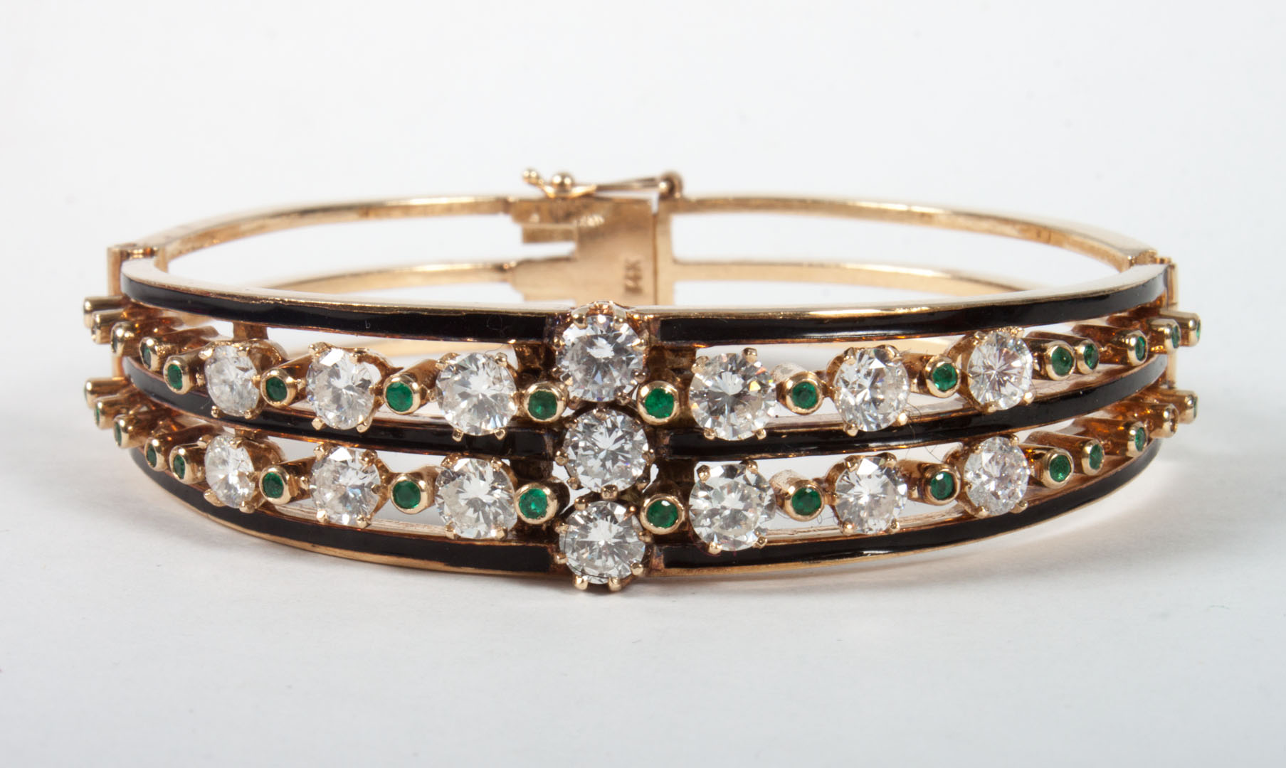 Appraisal: Enameled gold diamond and emerald bangle bracelet diamonds approx cts