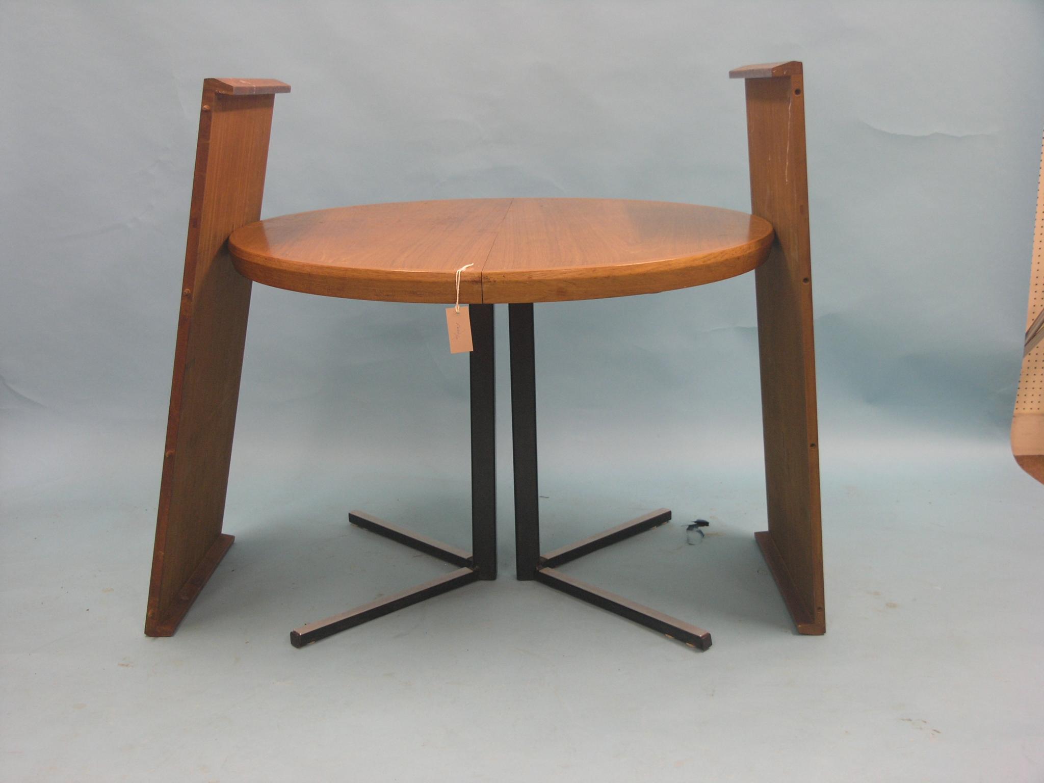 Appraisal: A 's circular teak dining table with two extra leaves