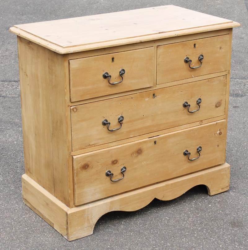 Appraisal: A stripped and lightly polished reclaimed pine chest of two