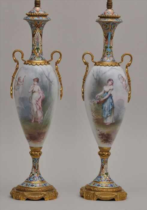 Appraisal: PAIR OF FRENCH GILT-METAL MOUNTED CHAMPLEV AND SEVRES-STYLE PORCELAIN URNS