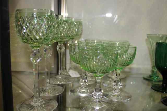 Appraisal: A SET OF FOUR GREEN TALL STEM WINE GLASSES and