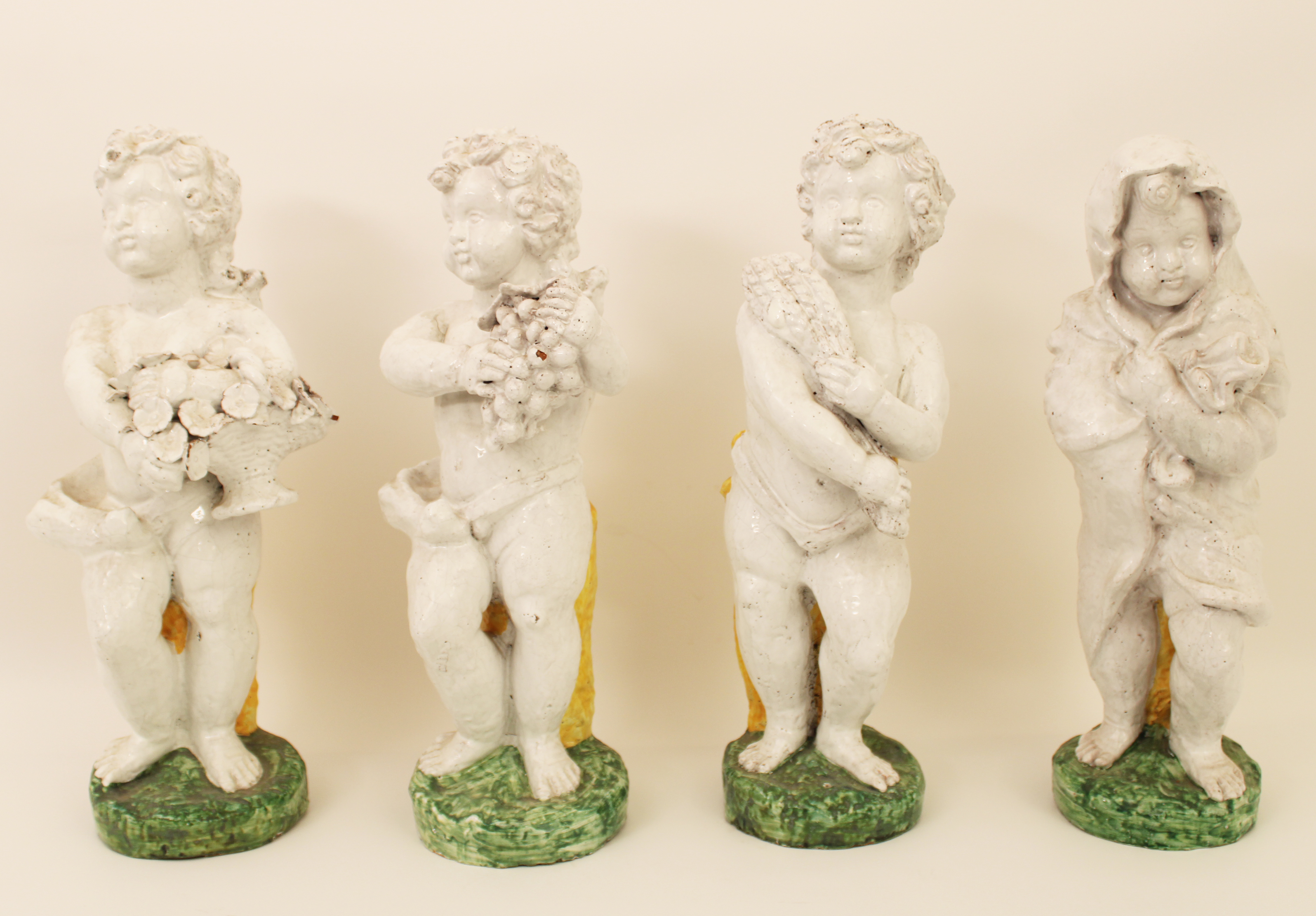 Appraisal: GROUP OF FOUR SEASONS TERRACOTTA Group of terracotta figures of