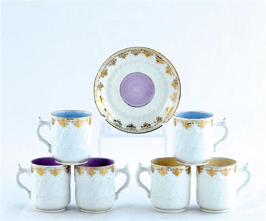 Appraisal: KPM porcelain demitasse set mottled white cylinder form body accented