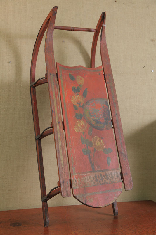 Appraisal: WOODEN SLED Paint decorated with red ground yellow flowers and