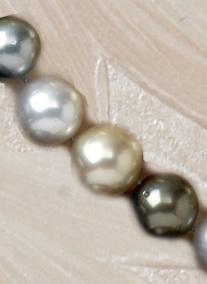 Appraisal: SOUTH SEA PEARLS Multi-color necklace with white gold and silver