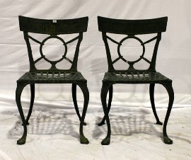 Appraisal: A pair of unusual cast iron garden occasional chairs