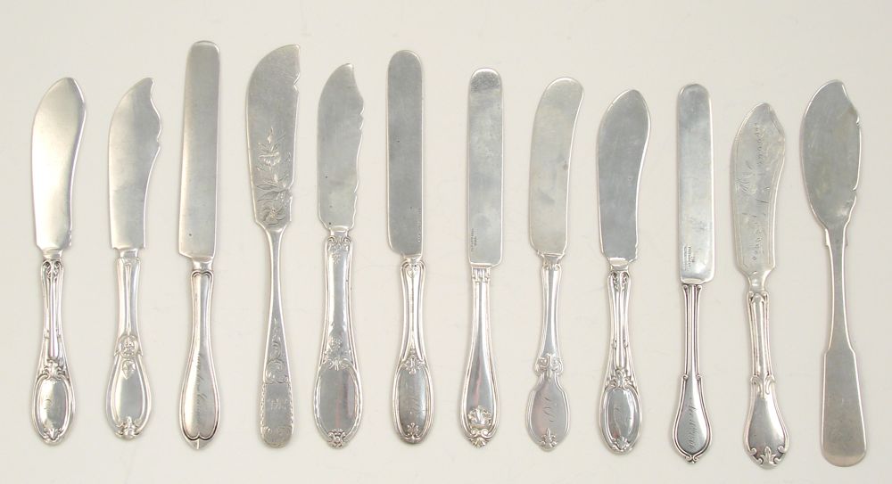 Appraisal: TWELVE STERLING AND COIN SILVER FLAT BUTTER SPREADERS By various