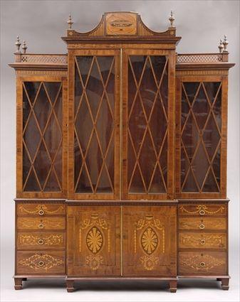 Appraisal: GEORGE III-STYLE MARQUETRY-INLAID MAHOGANY BREAKFRONT BOOKCASE The raised central crest