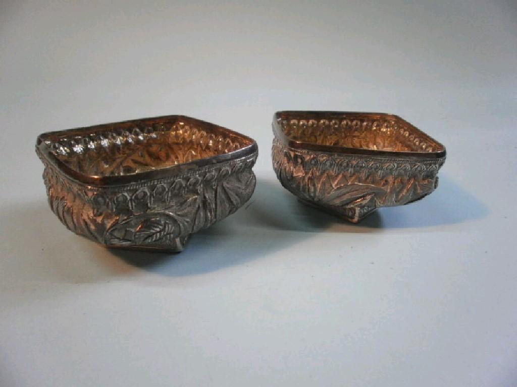 Appraisal: A pair of Eastern white metal square salts each decorated