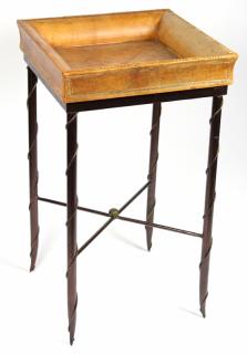 Appraisal: Jansen style embossed leather top occasional table on metal base