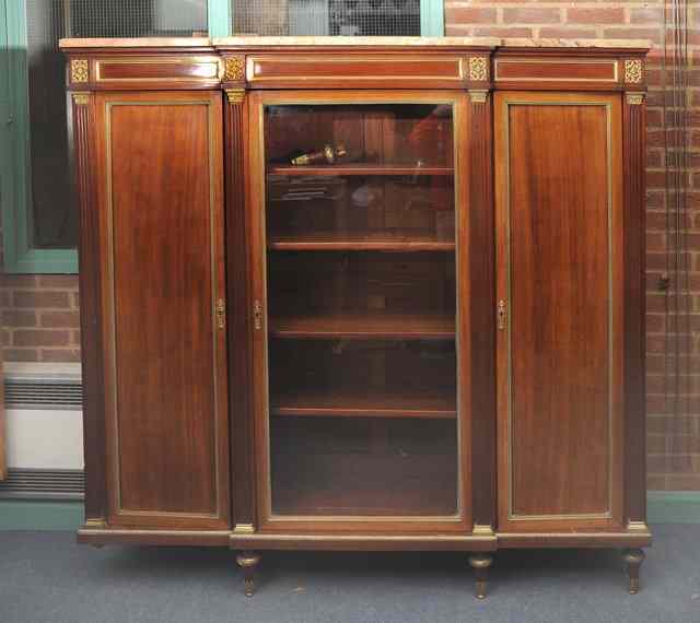 Appraisal: A TH CENTURY EMPIRE STYLE LIBRARY BREAKFRONT BOOKCASE the interior