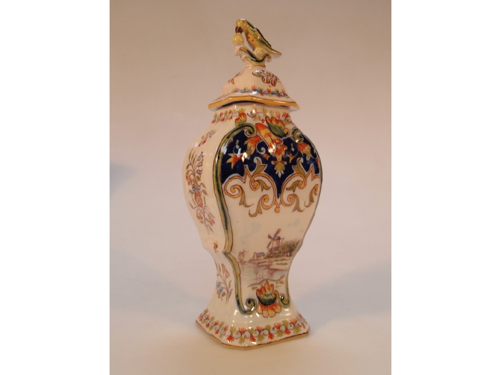 Appraisal: A Delft polychrome inverted baluster panel vase and cover cm