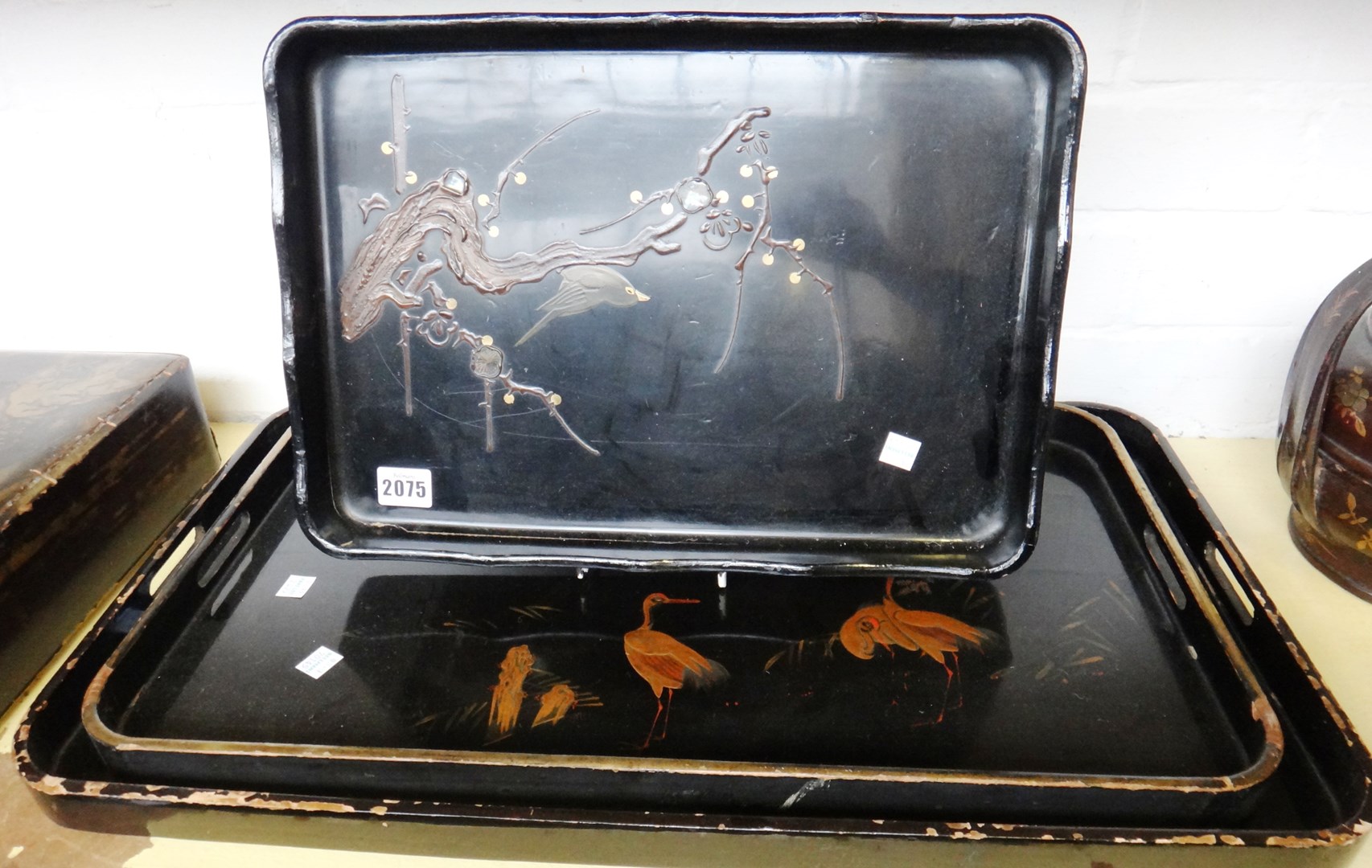 Appraisal: Two Japanese graduated lacquered trays early th century each decorated