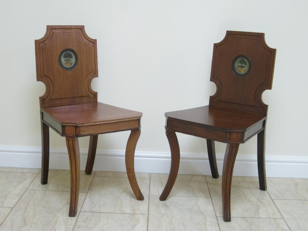 Appraisal: Pair of Regency mahogany Hall Chairs with shaped backs painted