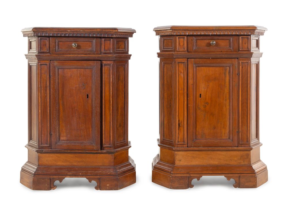 Appraisal: A Pair of North Italian Carved and Paneled Walnut Cabinets