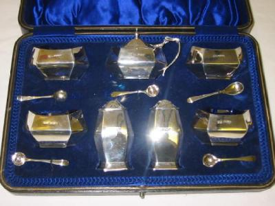 Appraisal: A MATCHED SEVEN PIECE CONDIMENT SET of bellied hexagonal form