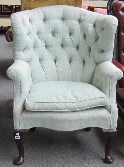 Appraisal: An th century style tub back armchair with serpentine seat