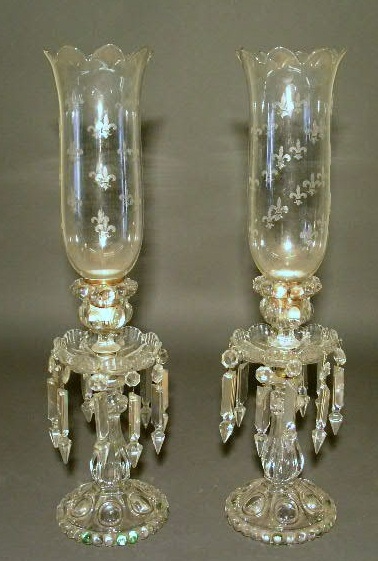 Appraisal: Pair of pressed glass candlesticks with drop prisms and fleur-de-lis