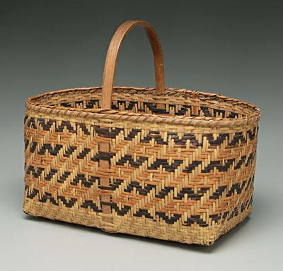 Appraisal: Cherokee river cane basket brown and orange weavers under bentwood