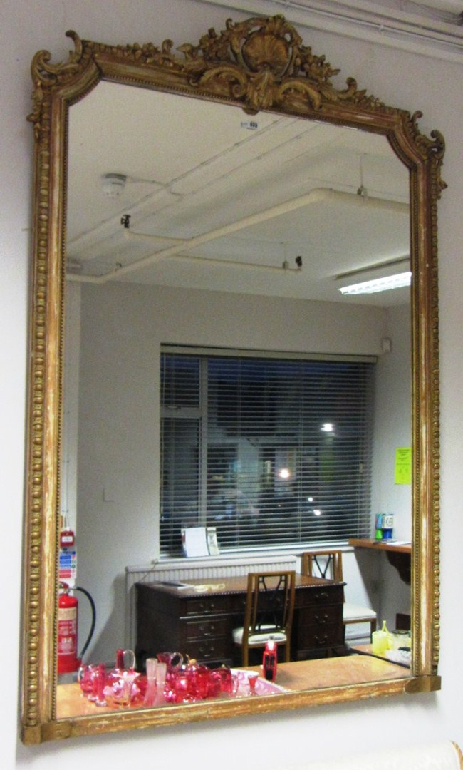 Appraisal: A th century gold painted overmantel mirror with shell crest