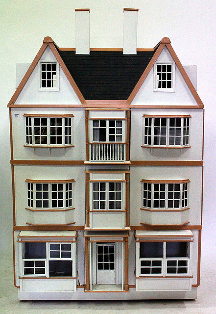 Appraisal: A LARGE CONTEMPORARY THREE STOREY DOLLS HOUSE with pitch roof