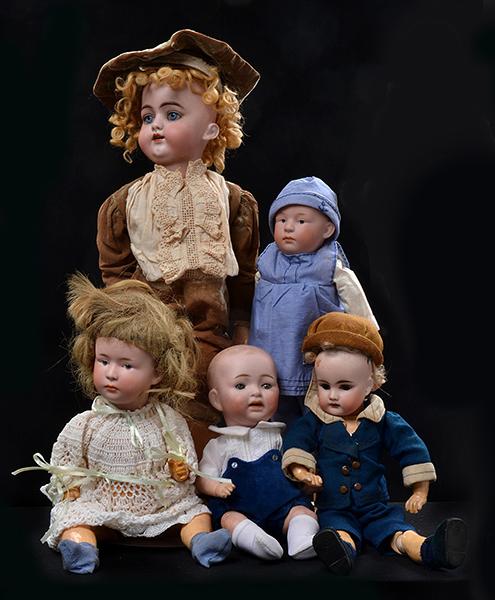 Appraisal: A COLLECTION OF FIVE GERMAN BISQUE HEAD BOY DOLLS AND