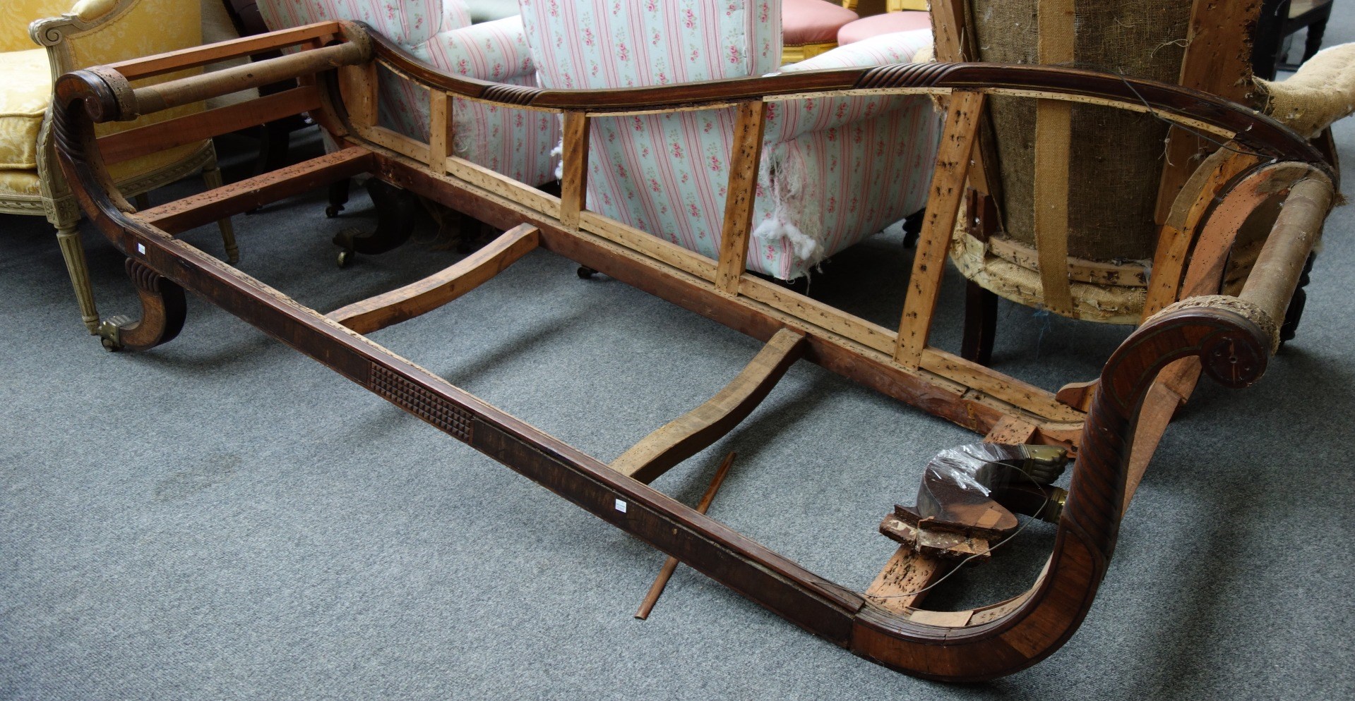 Appraisal: A Regency mahogany chaise longue frame with roll over ends