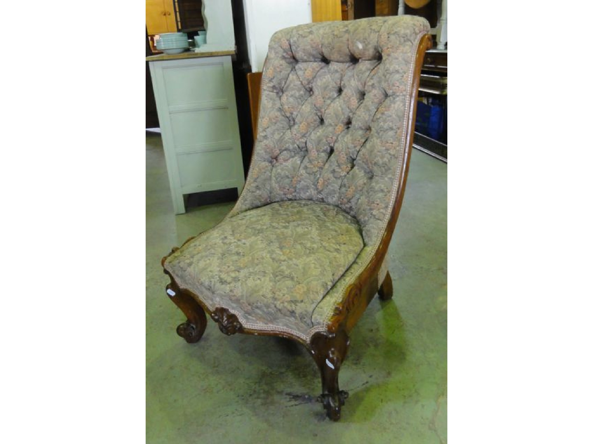 Appraisal: A Victorian drawing room nursing chair with floral patterned upholstered