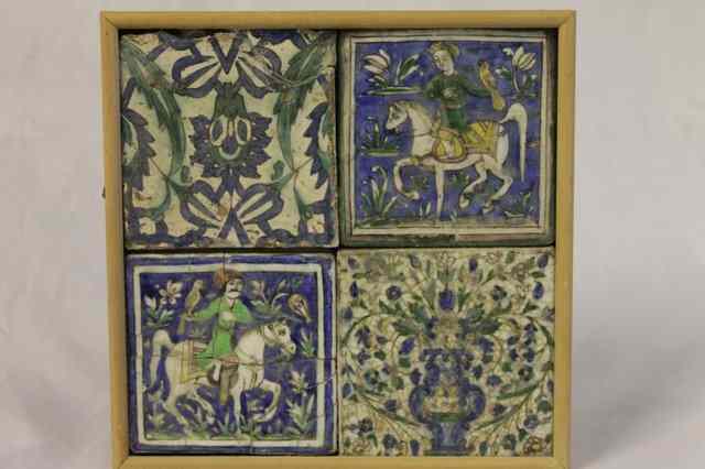 Appraisal: A PANEL OF FOUR PERSIAN POLYCHROME TILES two equestrian and