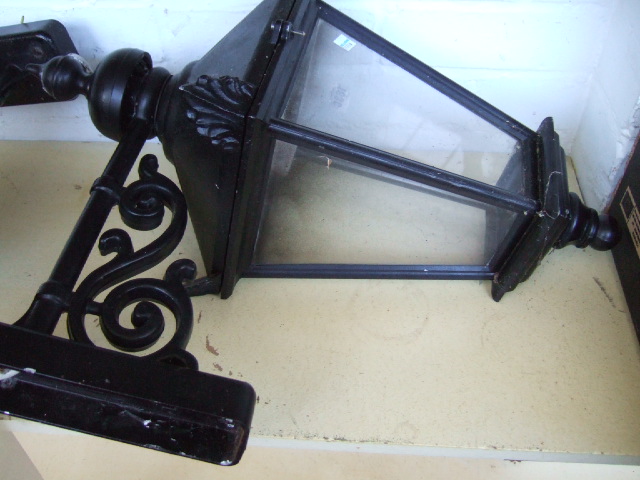 Appraisal: A pair of metal black painted exterior wall lanterns