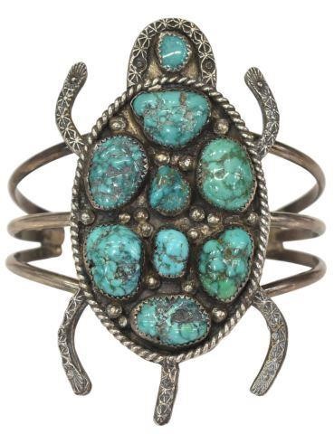 Appraisal: Native American figural silver content unknown and turquoise cuff bracelet