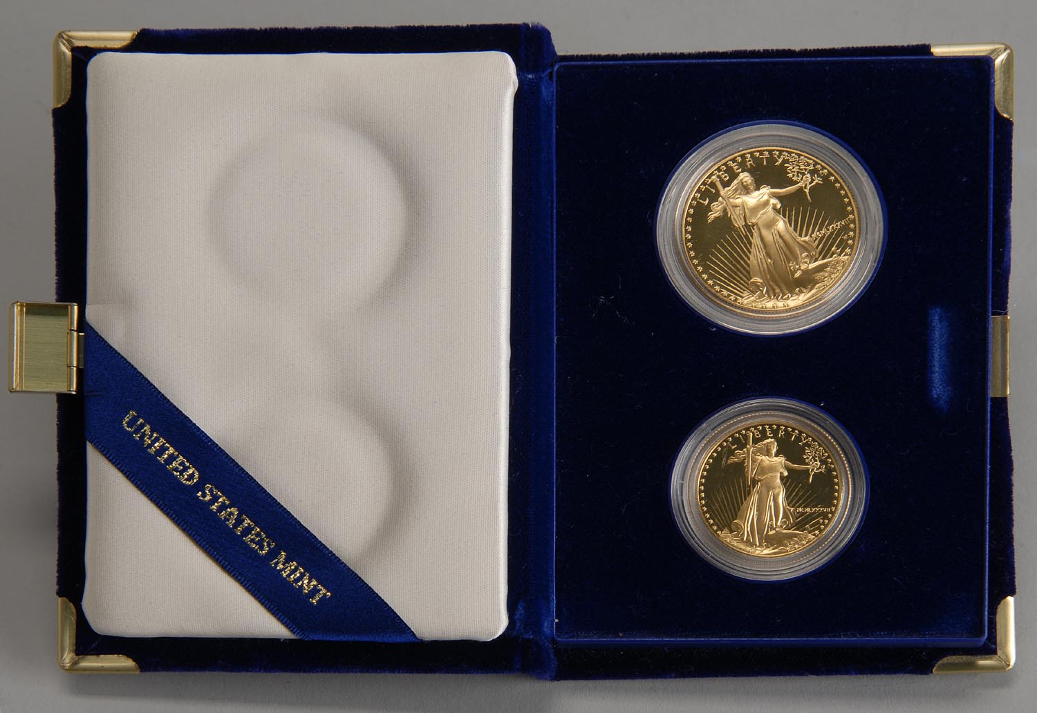 Appraisal: TWO-PIECE COMMEMORATIVE GOLD SET consisting of one and one coin