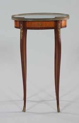 Appraisal: A Petite Oval Marquetry Table The marquetry decorated wood table