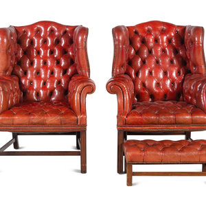 Appraisal: A Pair of Leather Wingback Armchairs with Ottoman Late th