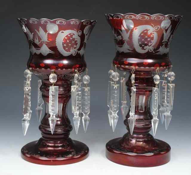 Appraisal: TWO SIMILAR BOHEMIAN RUBY GLASS LUSTRES with lozenge drops and