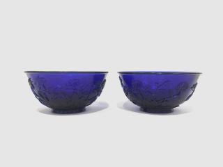 Appraisal: Pair of Chinese Blue Carved Peking Glass Bowls Pair of