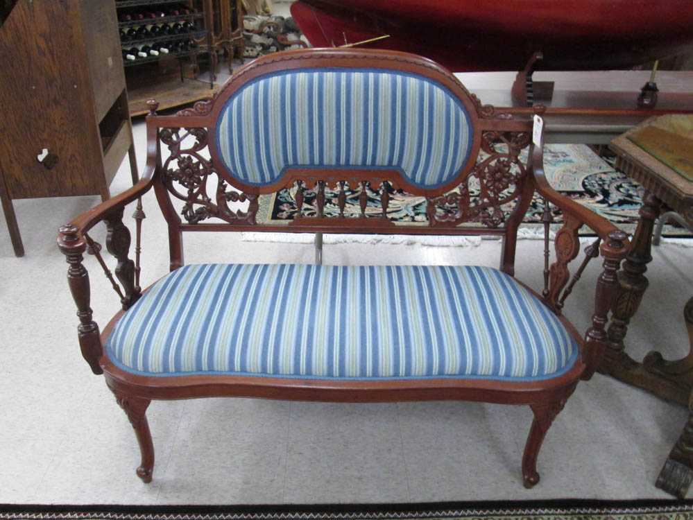 Appraisal: LATE VICTORIAN CARVED AND UPHOLSTERED CHERRY SETTEE American c H