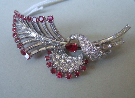 Appraisal: A ruby and diamond brooch designed as a spray mounted