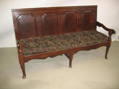 Appraisal: A GEORGE III OAK SETTLE the back with four ogee