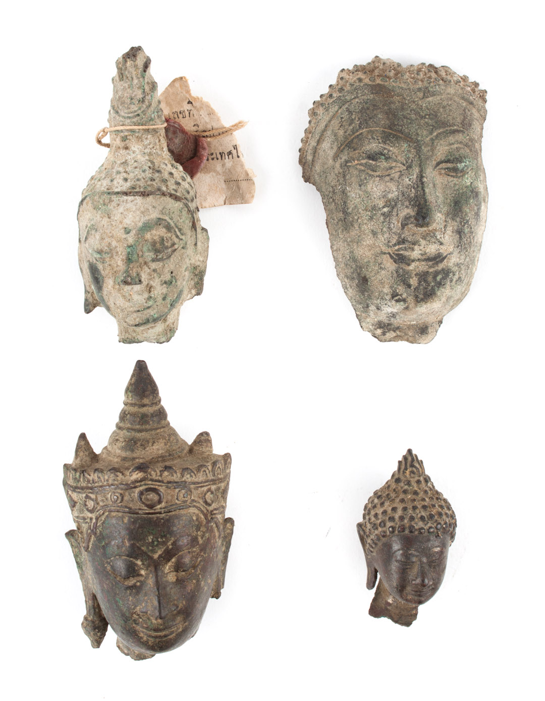 Appraisal: Four Thai bronze Buddha head fragments including Bangkok and earlier