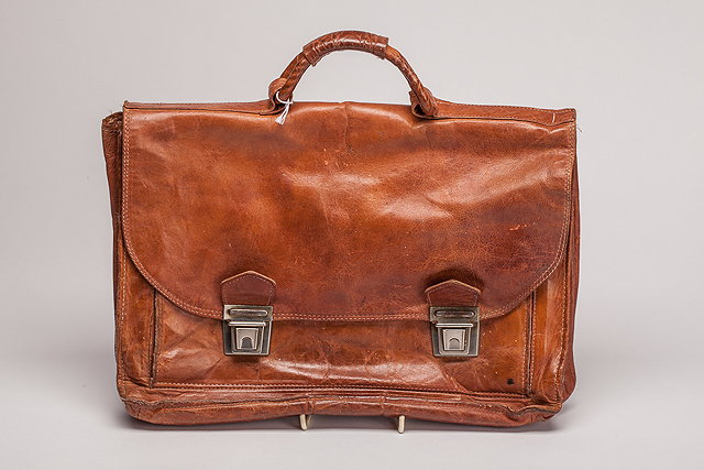 Appraisal: A s tan leather small briefcase or satchel lined in