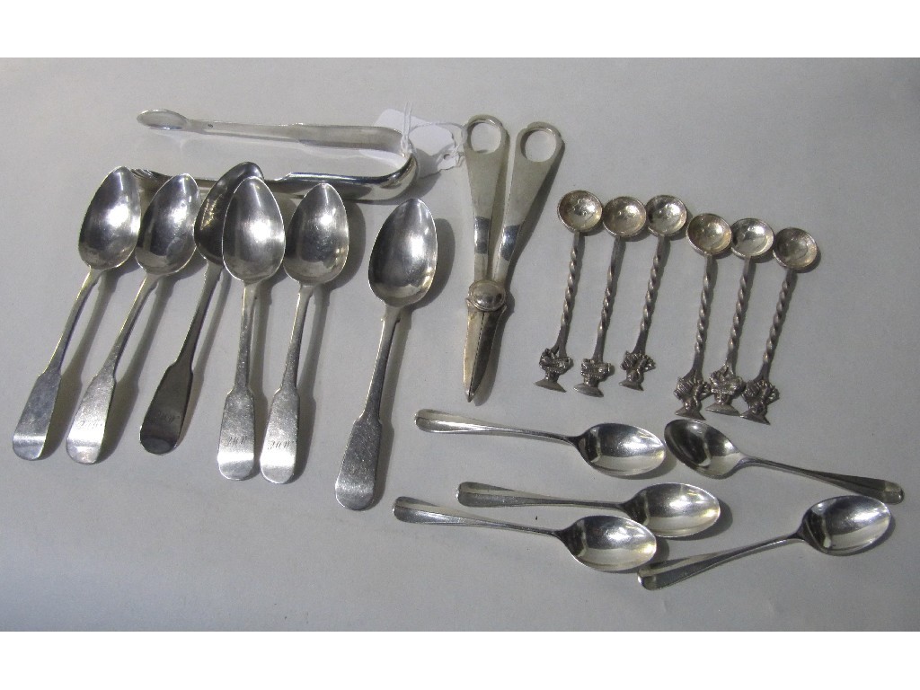 Appraisal: Lot comprising assorted silver spoons tongs and a pair of