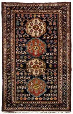 Appraisal: Caucasian rug four central medallions on dark blue field multiple