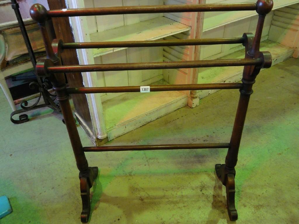 Appraisal: A Victorian mahogany towel rail on swept supports