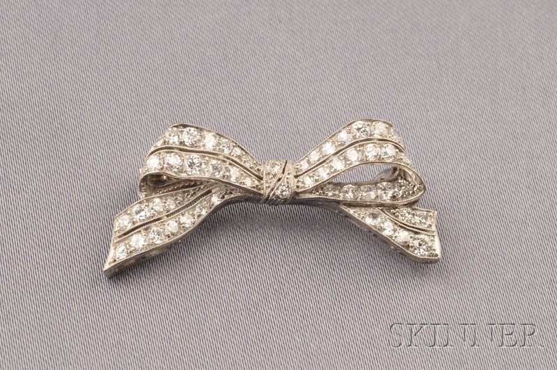 Appraisal: Art Deco Platinum and Diamond Bow Brooch the diminutive form