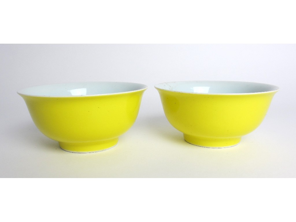 Appraisal: A pair of Chinese yellow ground rice bowls bearing six