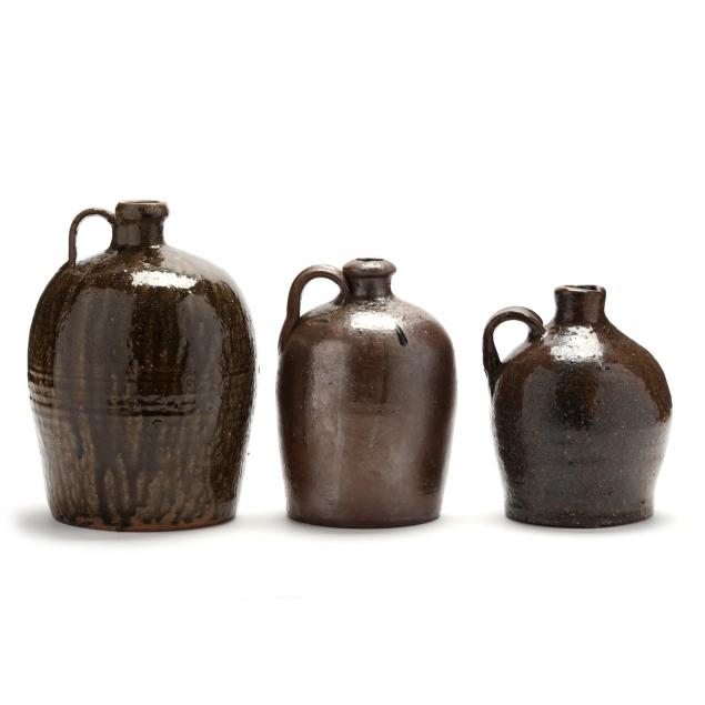 Appraisal: THREE ALKALINE GLAZED JUGS WESTERN NC th century stoneware two