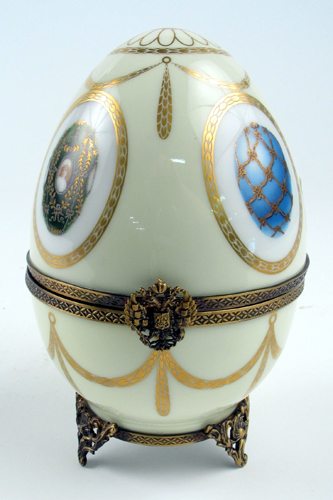 Appraisal: A LIMOGES FRENCH FABERGE PORCELAIN EGG-SHAPED MUSIC BOX decorated with